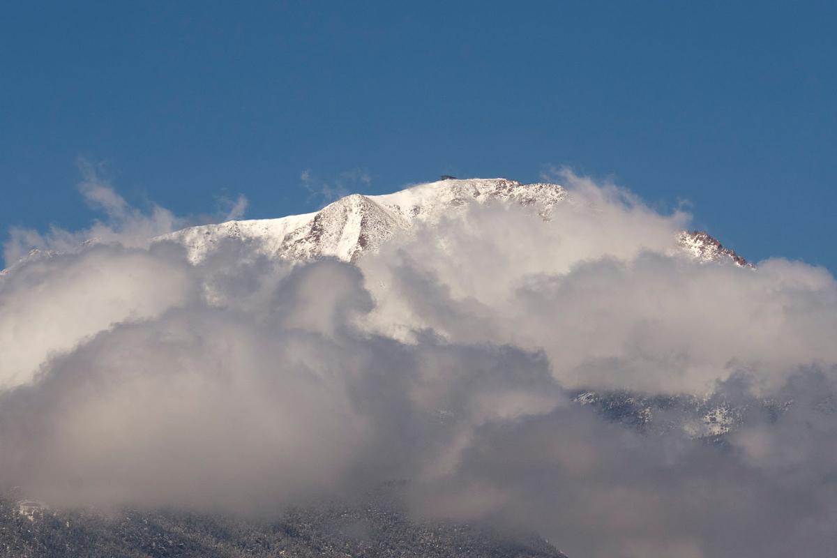   Snow covers Pikes Peak in the Rocky Mountains on 4/6/23. Photo by Lonnie Timmons III / Colorado College.
